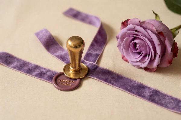 Velvet ribbon and plum rose still life illustrating the fetish and SPH category